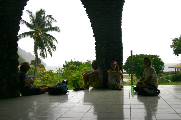 Tod & Julie of Capaz on the edges, Robert from Lawur and Laura from New Dawn wait out the rain.